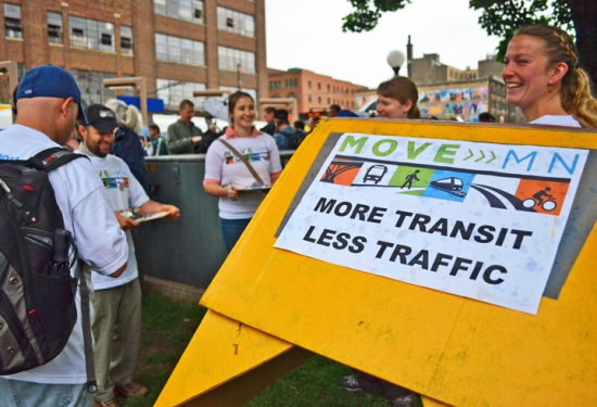 Abby Tomasek wore a cardboard light-rail costume to the ribbon cutting. She and other activists used the event as an opportunity to sign transit-users up for MoveMN, an advocacy group pushing broad investments in the state's transportation infrastructure.