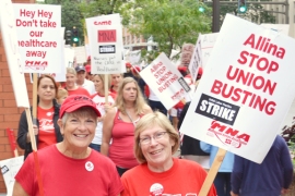 Nurses picket outside United Hospital during an open-ended strike that began at five Allina Health facilities in the Twin Cities on Labor Day.